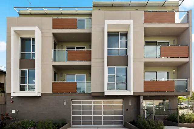 a front view of a building with a glass door and a window