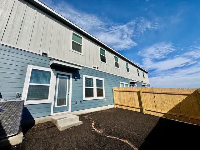 a front view of a house with a street