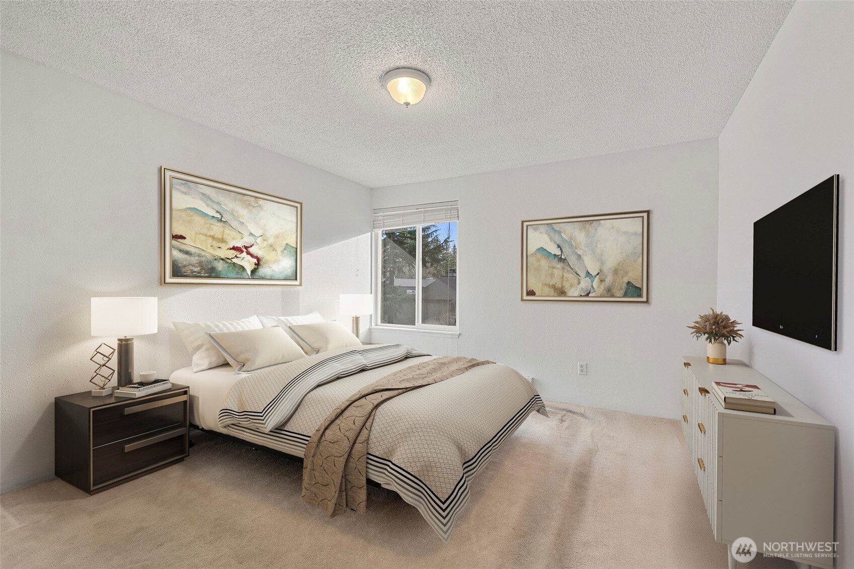 17514 151st Avenue Southeast, Unit I16 Renton, WA 98058 - Photo 7 of 16 a bedroom with a bed and a flat screen tv