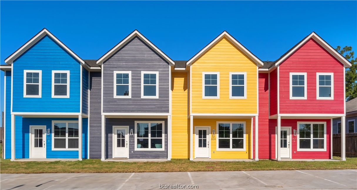 front view of brick house with a yard