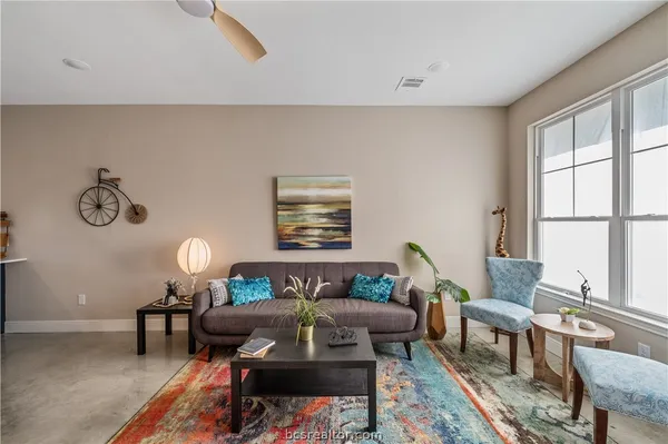 a living room with furniture and a window