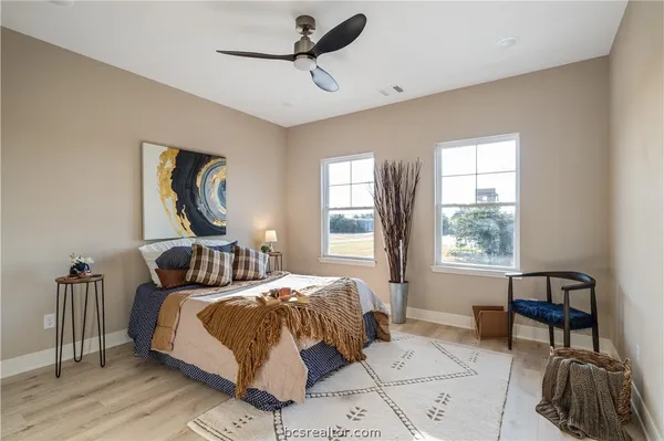 a bedroom with bed and a window