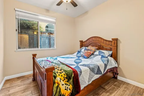 a bedroom with a bed and window