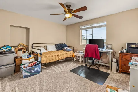 a bedroom with furniture and a window