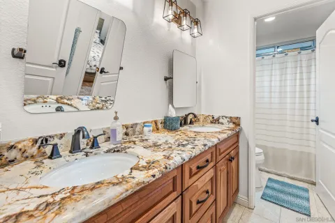 a bathroom with a sink double vanity and a mirror
