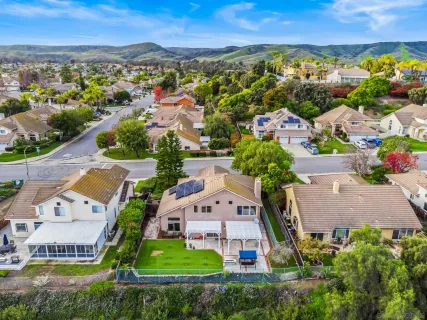 an aerial view of a house with a garden