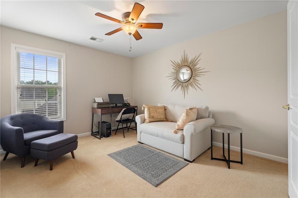 878 Scales Road Suwanee, GA 30024 - Photo 14 of 17 a living room with furniture and a large window