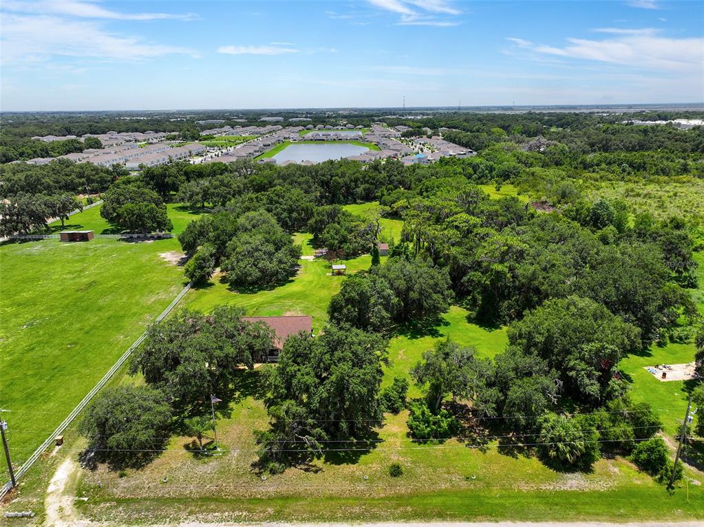2830 Horton Road Kissimmee, FL 34744 - Photo 24 of 35 an aerial view of a houses with outdoor space and trees all around