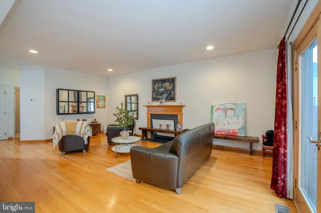 a living room with furniture and a lamp