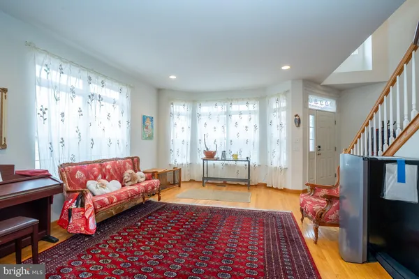 a living room with furniture and a rug