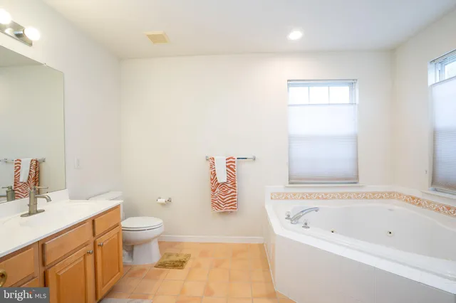 a bathroom with a bathtub sink and toilet