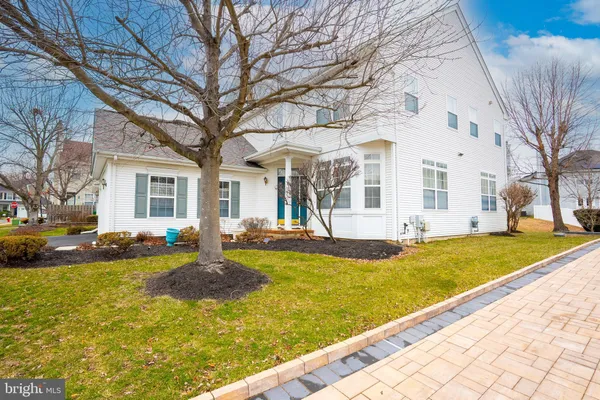 a view of a house with swimming pool and a yard