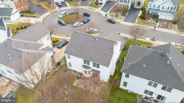 an aerial view of a house with a swimming pool