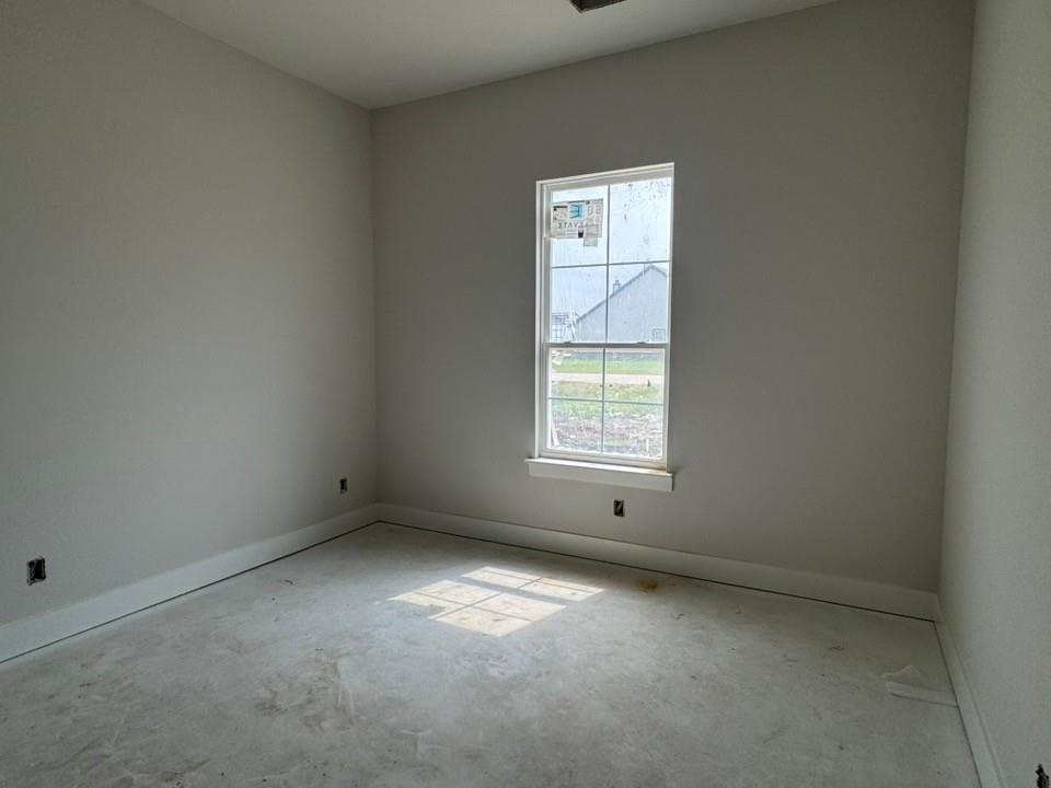 2305 Quartz Street Krum, TX 76249 - Photo 16 of 18 an empty room with a window