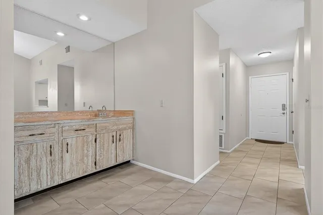 a bathroom with a granite countertop sink mirror and