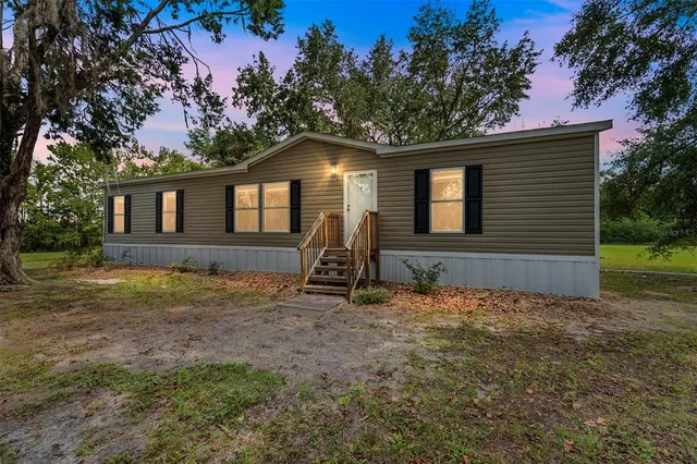 a house with trees in the background