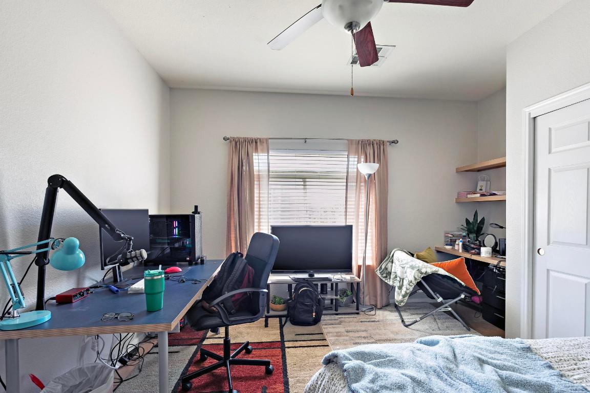 910 West 25th Street, Unit 406 Austin, TX 78705 - Photo 13 of 18 a workspace with furniture and a window