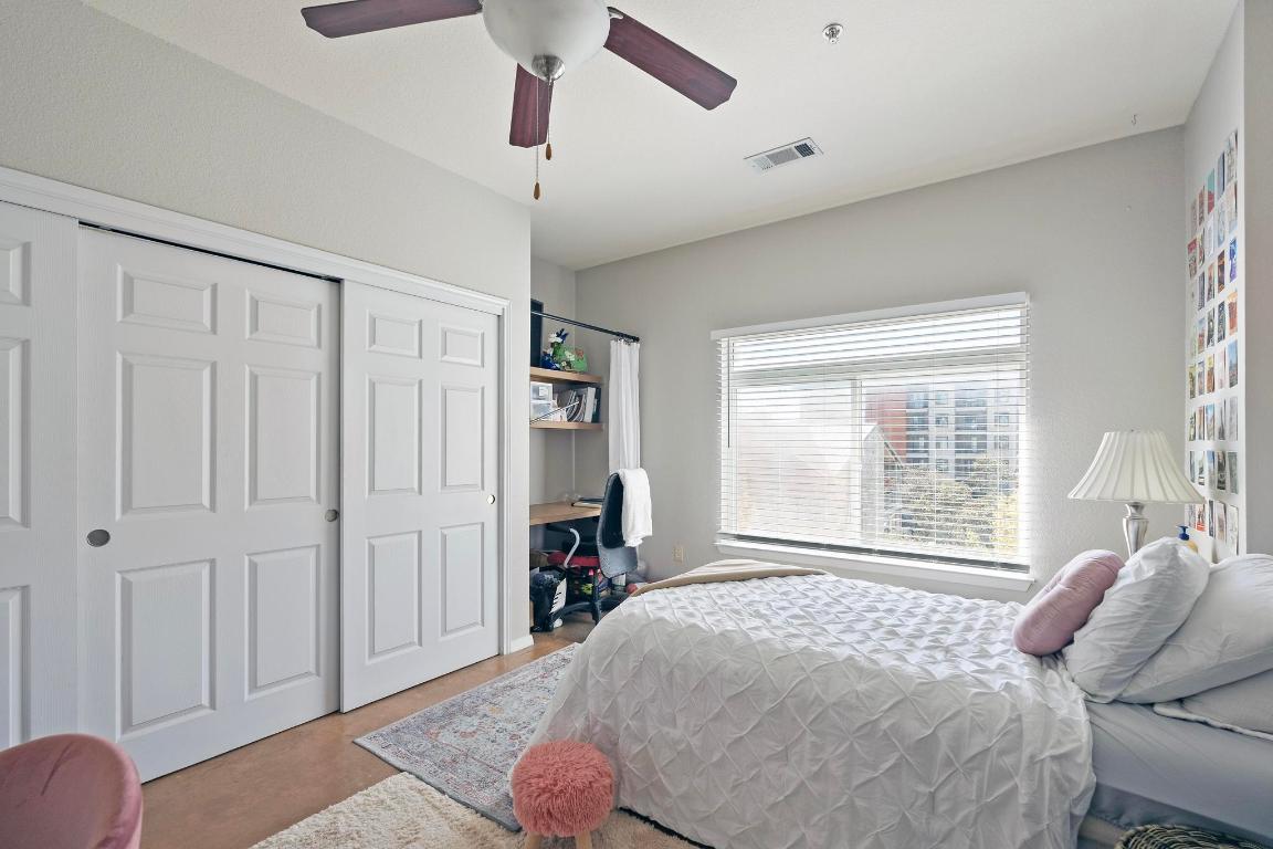 910 West 25th Street, Unit 406 Austin, TX 78705 - Photo 8 of 18 a bedroom with a bed closet and a window