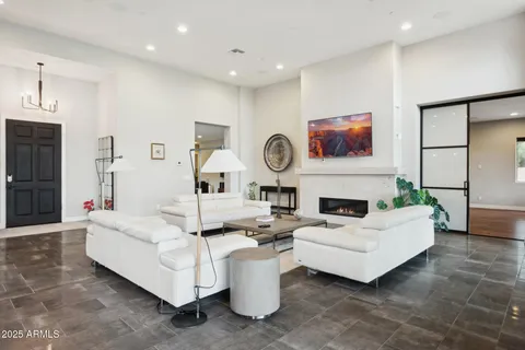 a large white kitchen with a sink and white appliances