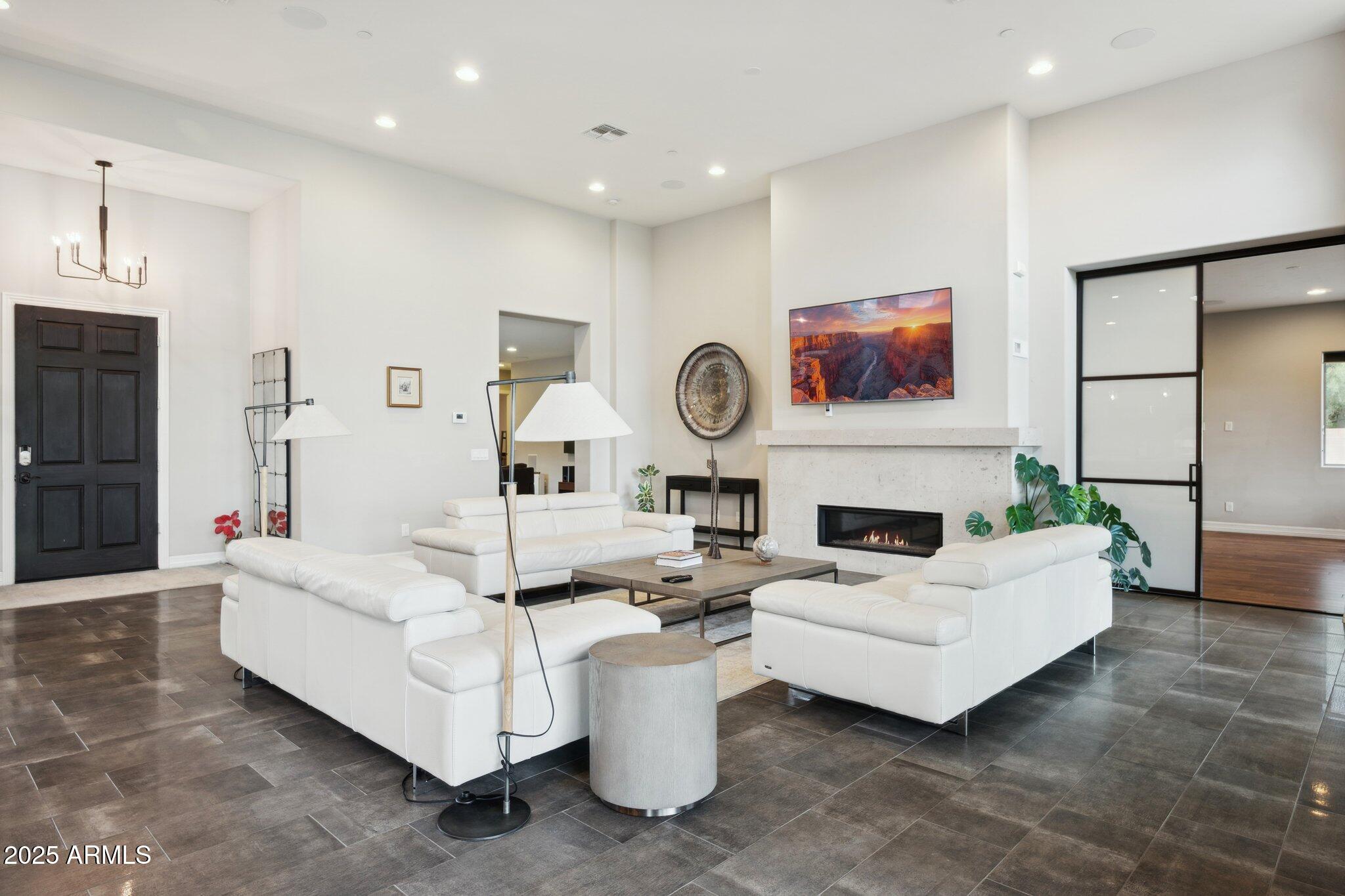 5237 East Montgomery Road Cave Creek, AZ 85331 - Photo 11 of 79 a living room with furniture and a fireplace