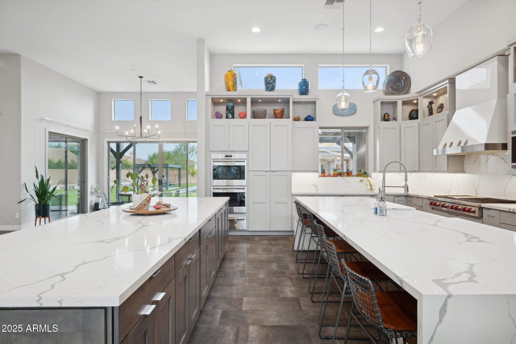 5237 East Montgomery Road Cave Creek, AZ 85331 - Photo 19 of 79 a kitchen with stainless steel appliances granite countertop a sink and cabinets