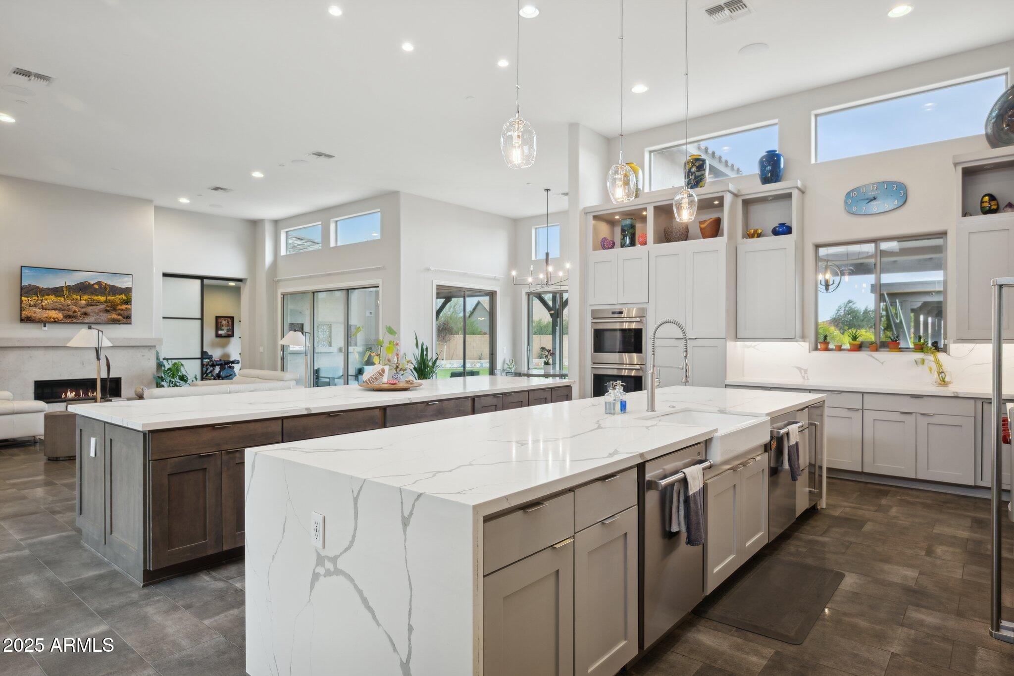5237 East Montgomery Road Cave Creek, AZ 85331 - Photo 20 of 79 a large white kitchen with a sink and white appliances