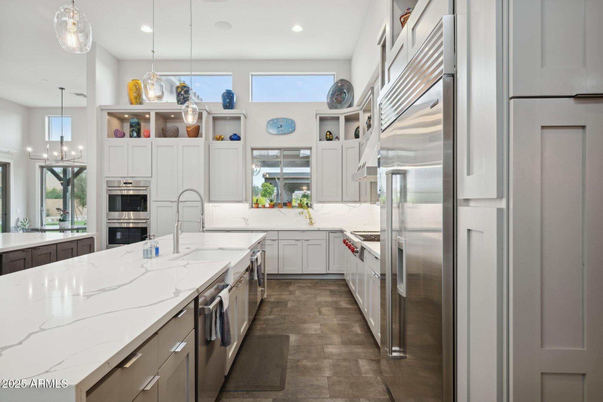 5237 East Montgomery Road Cave Creek, AZ 85331 - Photo 21 of 79 a kitchen with stainless steel appliances granite countertop a refrigerator and a sink