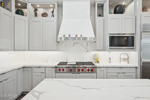 a bedroom with a bed and cabinets