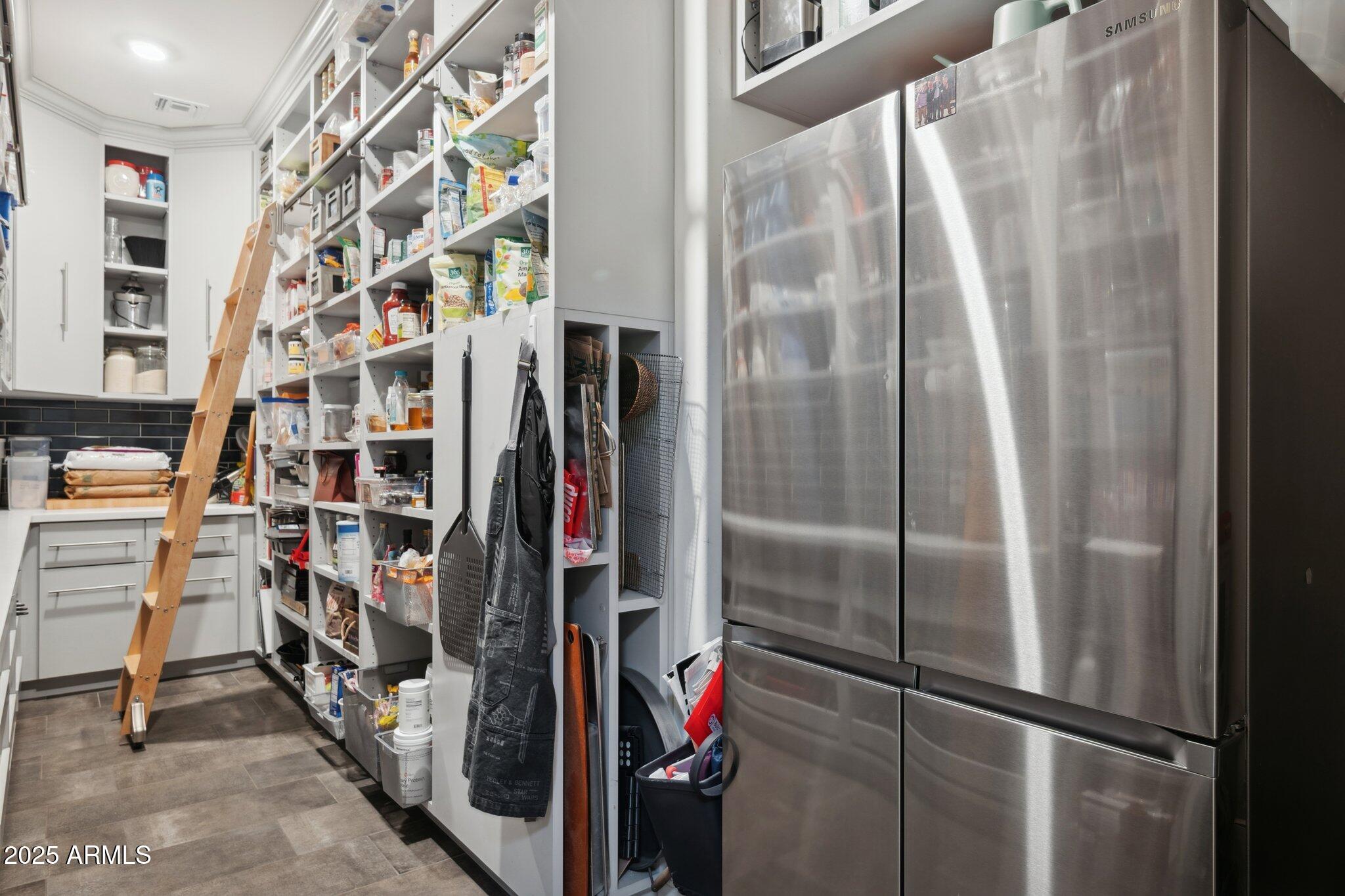 5237 East Montgomery Road Cave Creek, AZ 85331 - Photo 23 of 79 a view of walk in closet with clothes and shoes