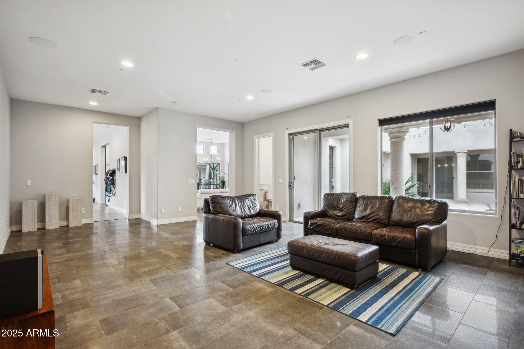 5237 East Montgomery Road Cave Creek, AZ 85331 - Photo 27 of 79 a living room with furniture and a couch