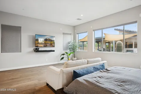 a bedroom with a bed and window