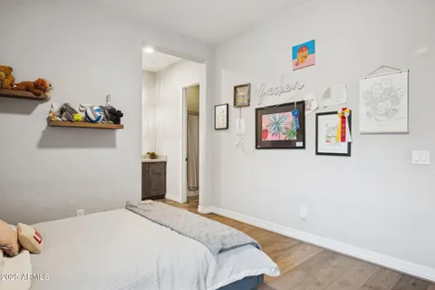 a living room with furniture a window and gym equipment