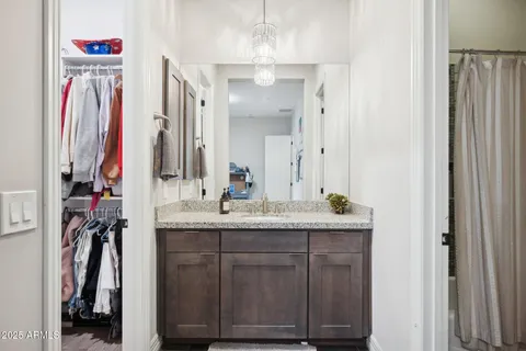 a kitchen with granite countertop a stove top oven sink and cabinets
