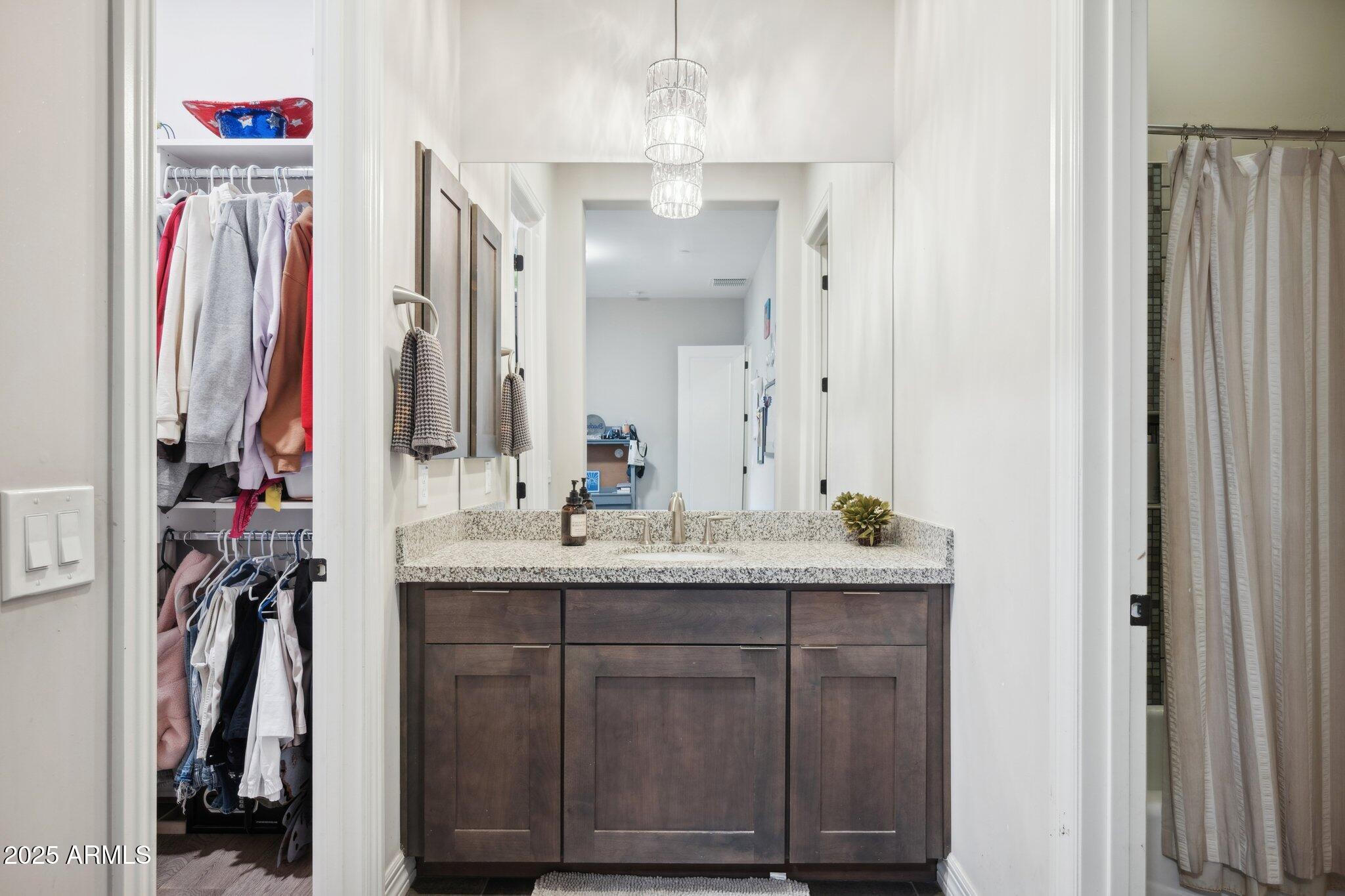 5237 East Montgomery Road Cave Creek, AZ 85331 - Photo 36 of 79 a en suite bathroom with a sink and a mirror