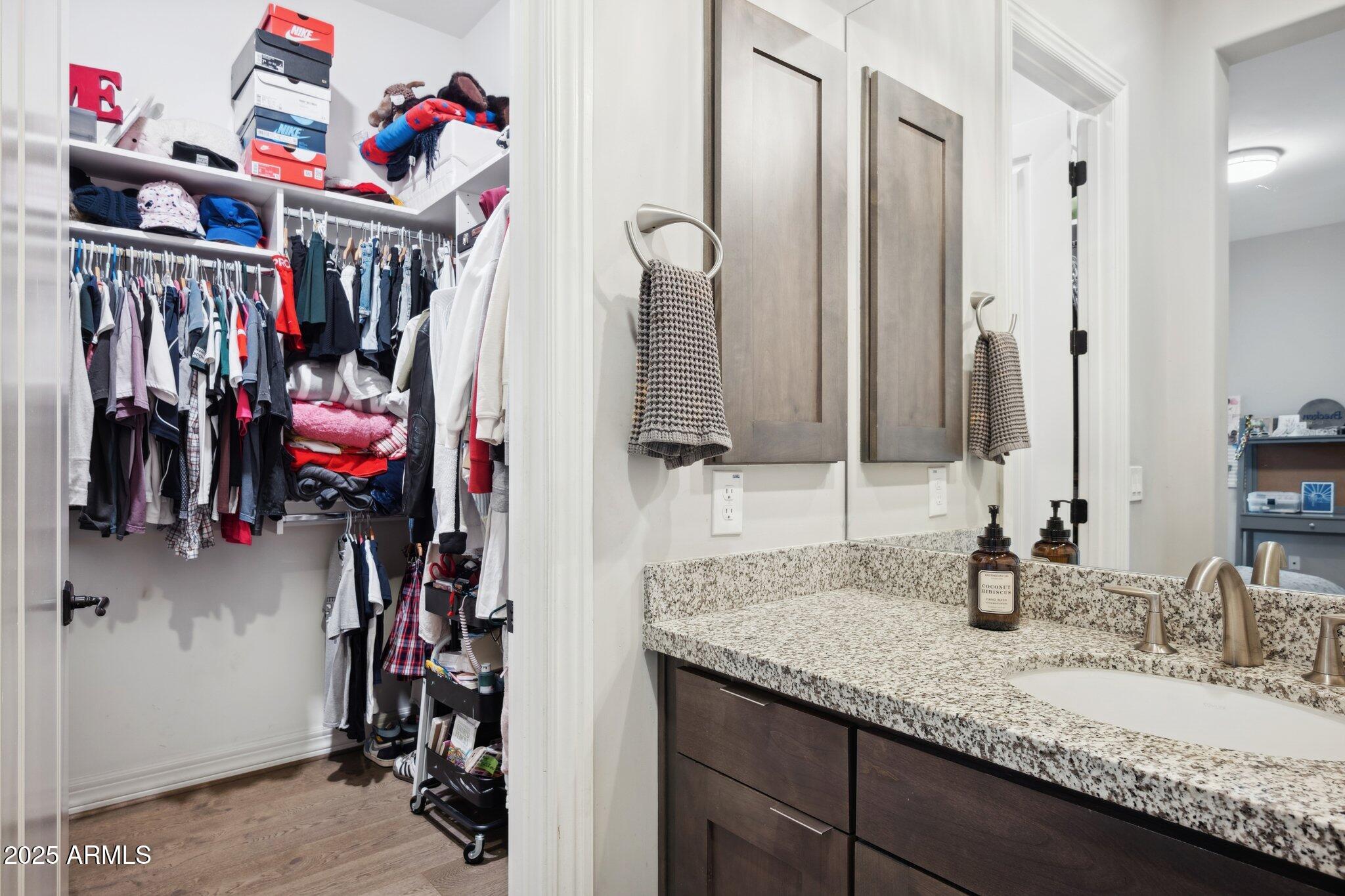 5237 East Montgomery Road Cave Creek, AZ 85331 - Photo 37 of 79 a view of walk in closet with clothes and shoes