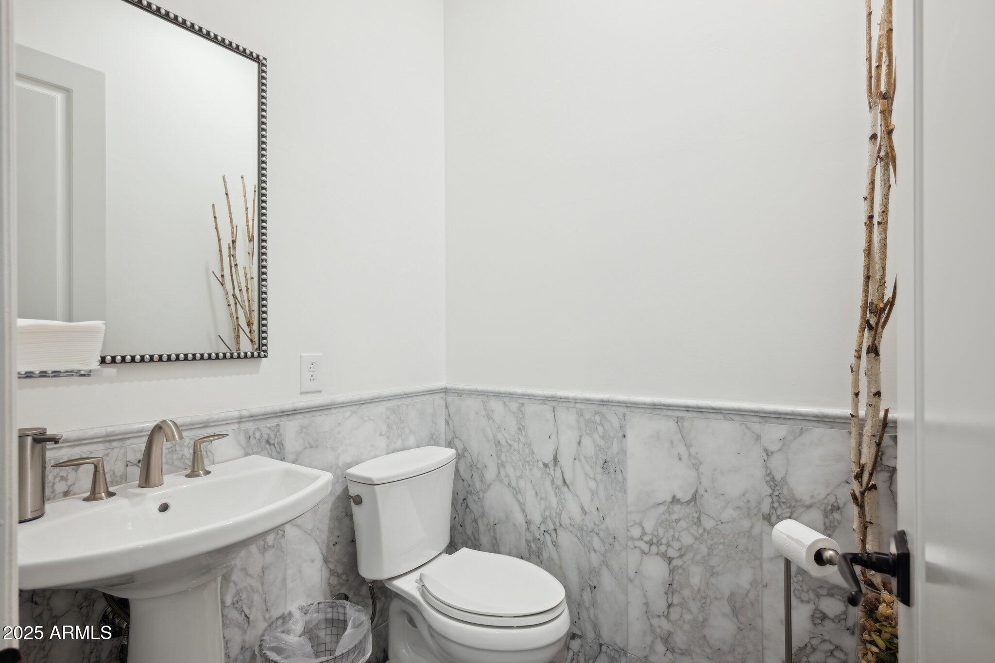 5237 East Montgomery Road Cave Creek, AZ 85331 - Photo 41 of 79 a bathroom with a sink a toilet and a mirror