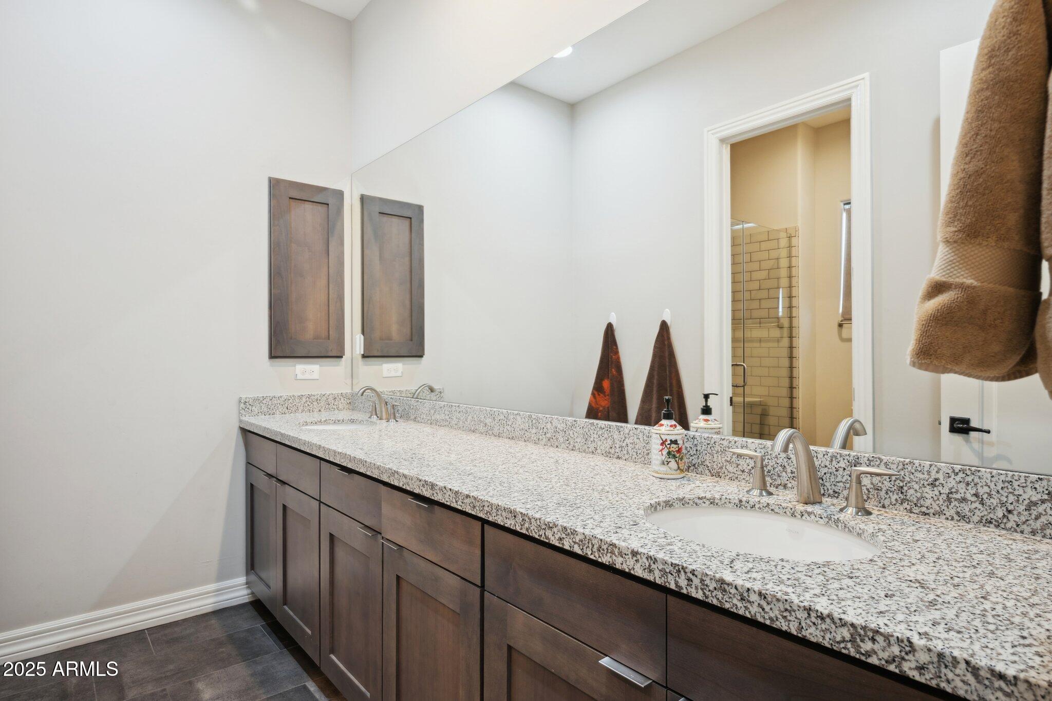 5237 East Montgomery Road Cave Creek, AZ 85331 - Photo 44 of 79 a bathroom with a granite countertop sink and a mirror