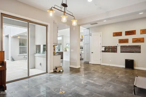 a bathroom with a granite countertop sink toilet and mirror
