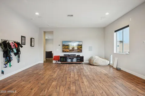 a view of swimming pool with a garden and seating area