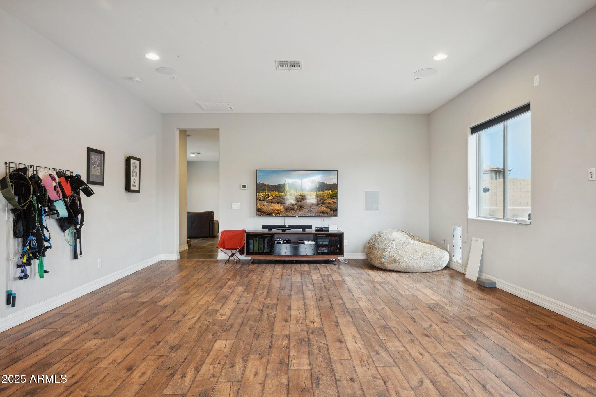 5237 East Montgomery Road Cave Creek, AZ 85331 - Photo 48 of 79 a living room with furniture and a flat screen tv