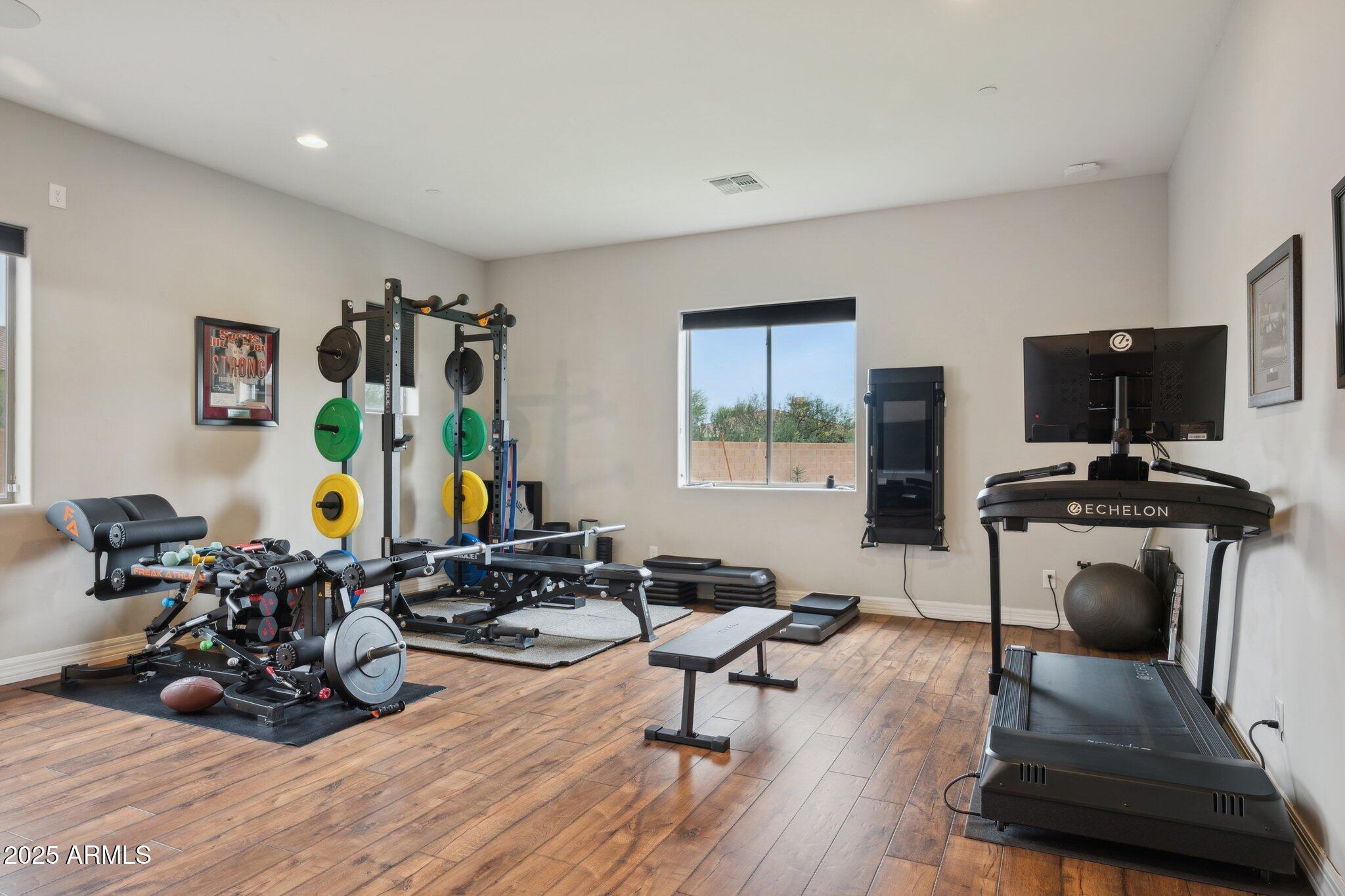 5237 East Montgomery Road Cave Creek, AZ 85331 - Photo 50 of 79 a living room with furniture a window and gym equipment