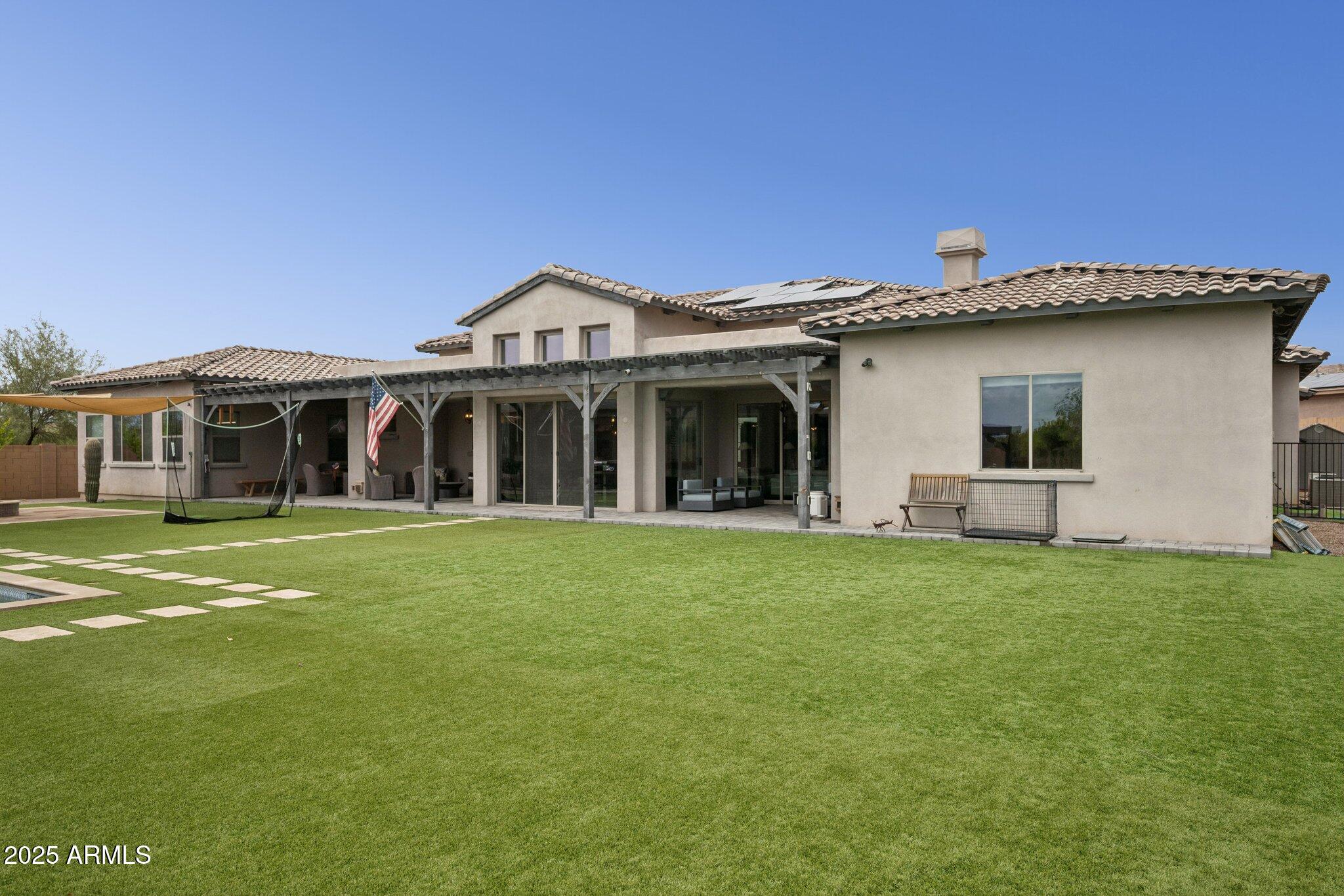 5237 East Montgomery Road Cave Creek, AZ 85331 - Photo 61 of 79 a front view of a house with a garden