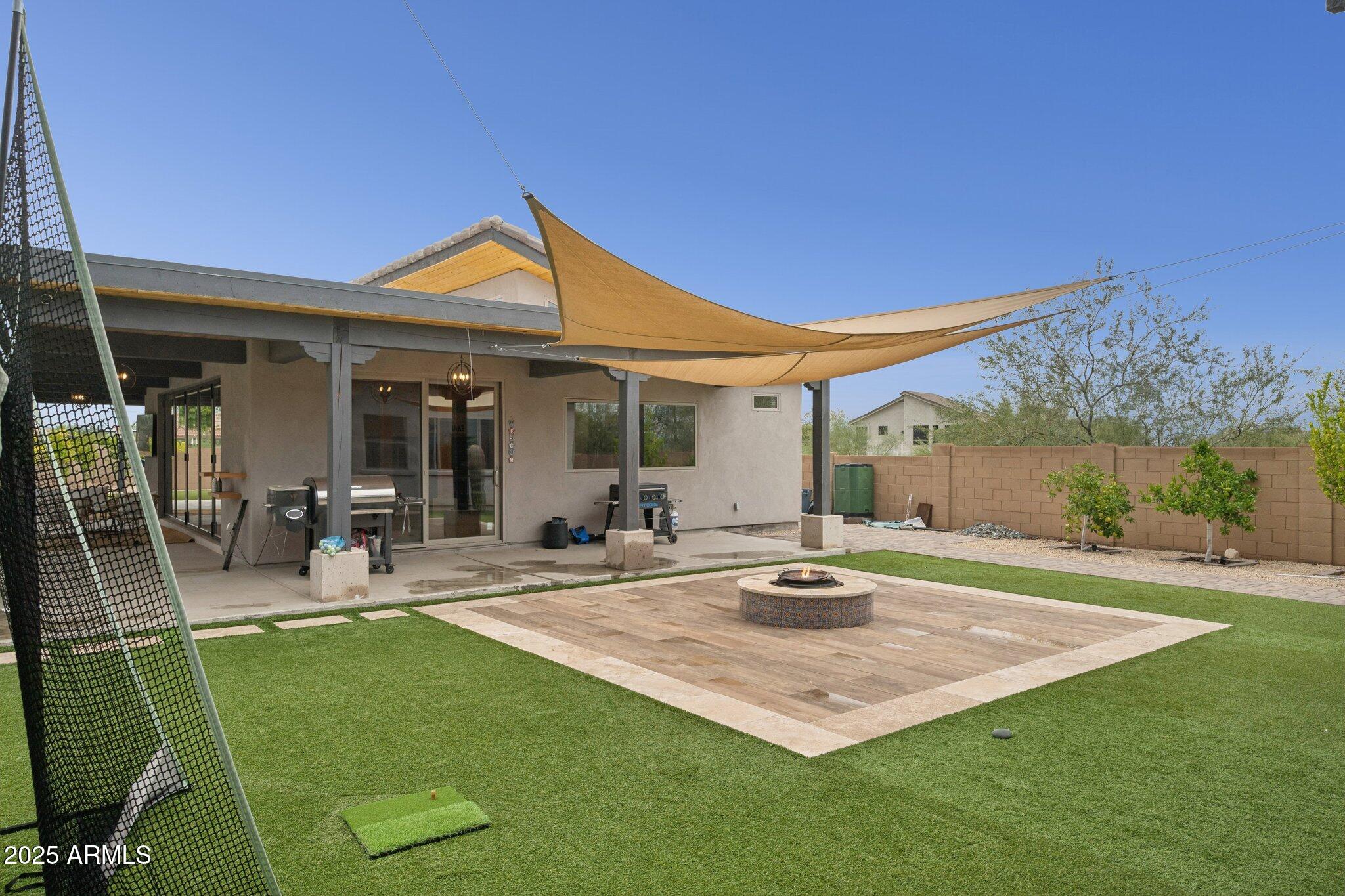 5237 East Montgomery Road Cave Creek, AZ 85331 - Photo 62 of 79 a backyard of a house with table and chairs