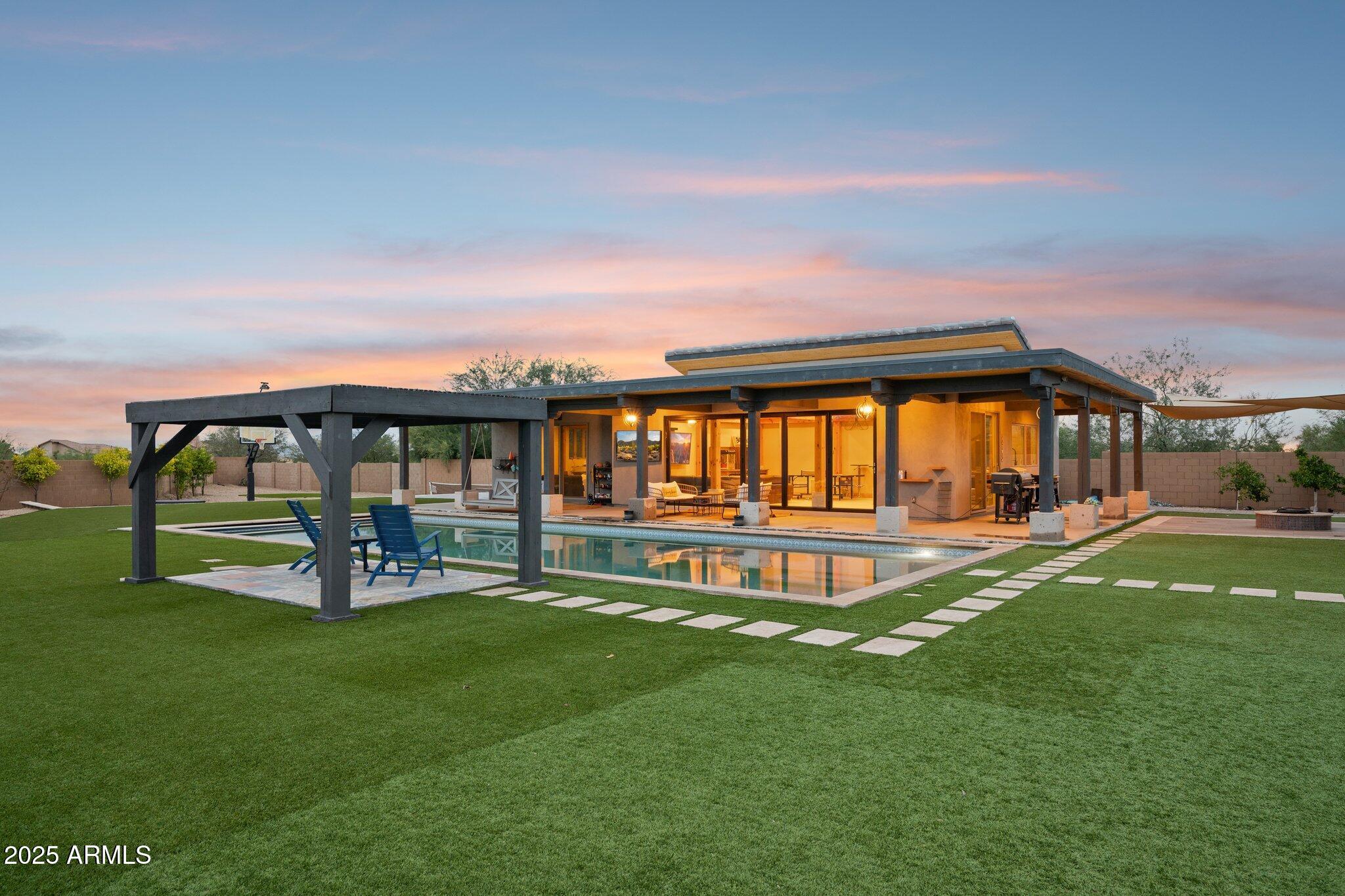 5237 East Montgomery Road Cave Creek, AZ 85331 - Photo 71 of 79 a swimming pool with outdoor seating and garden