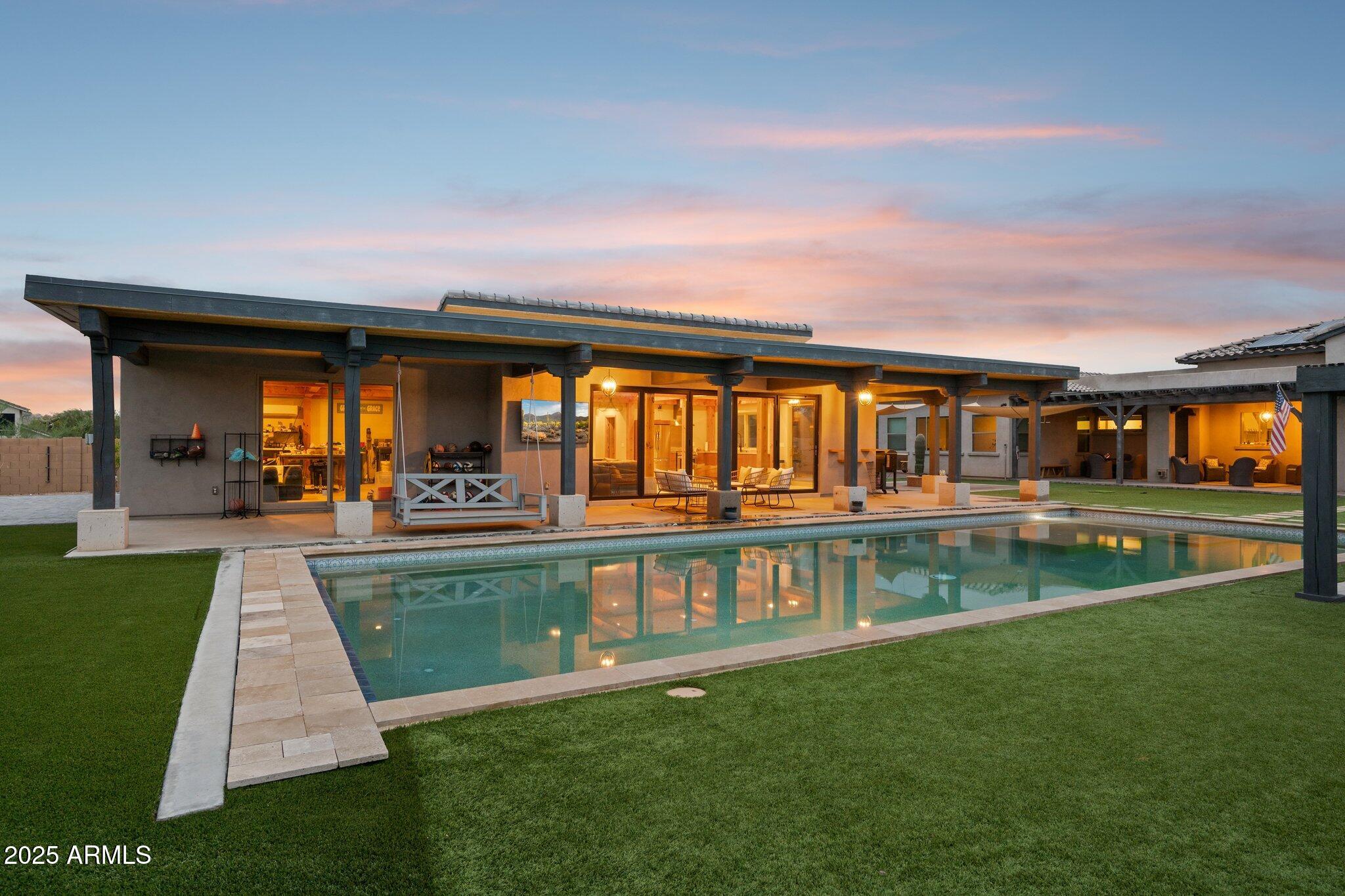 5237 East Montgomery Road Cave Creek, AZ 85331 - Photo 72 of 79 a view of swimming pool with a garden and seating area