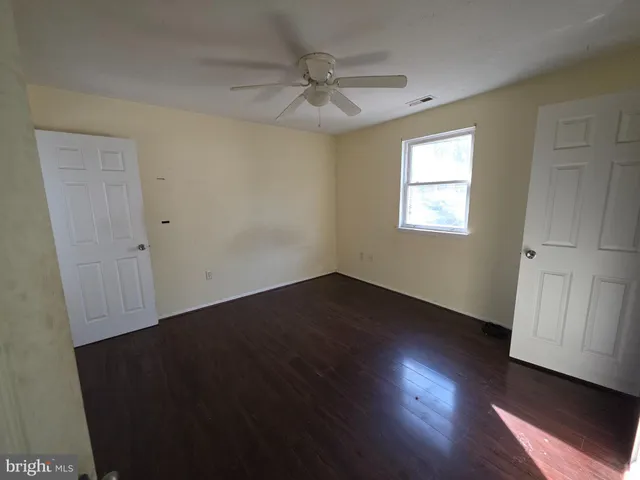 a bathroom with a sink toilet and mirror