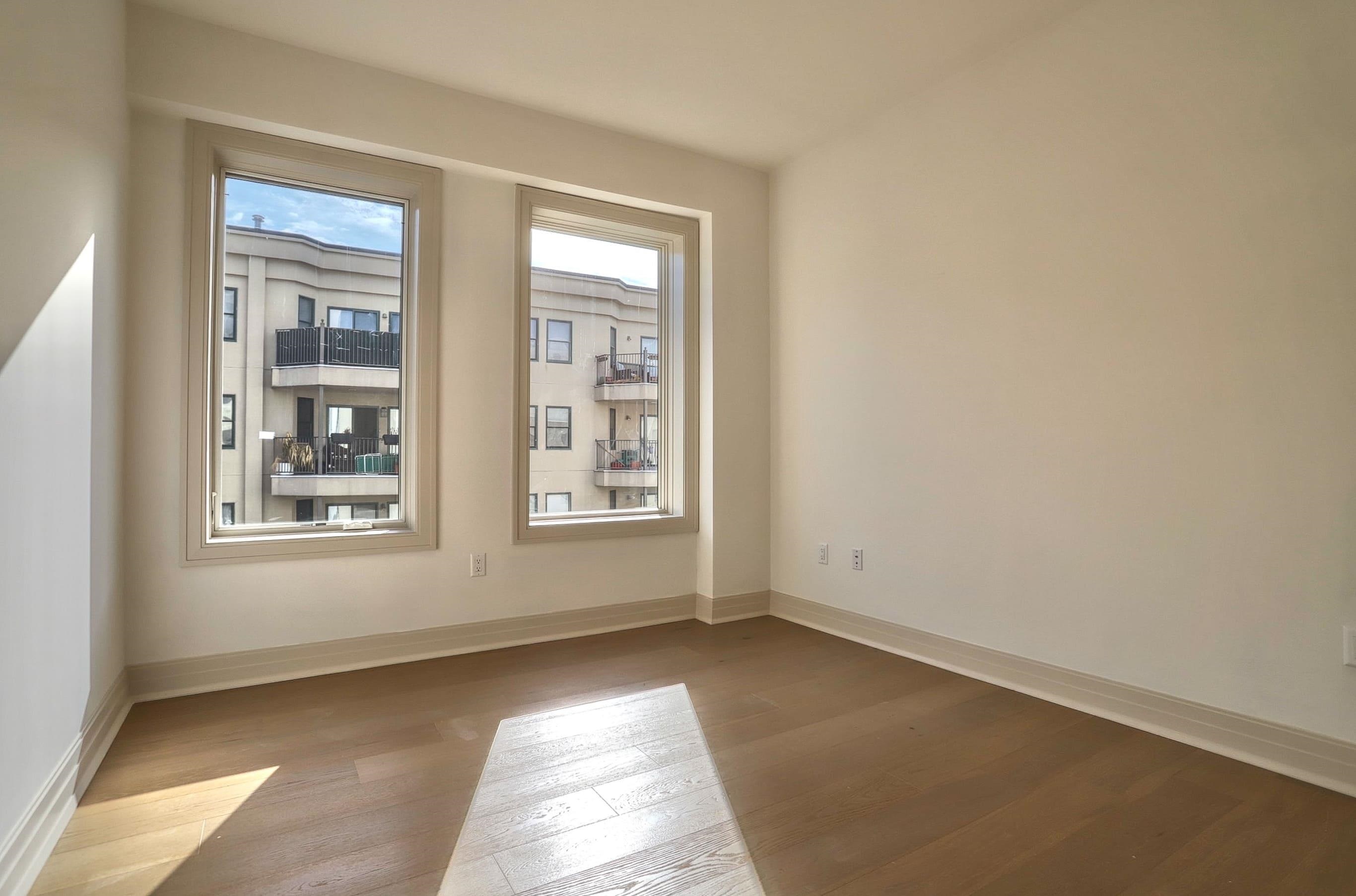 921 Madison Street, Unit 401 Hoboken, NJ 07030 - Photo 12 of 32 an empty room with windows