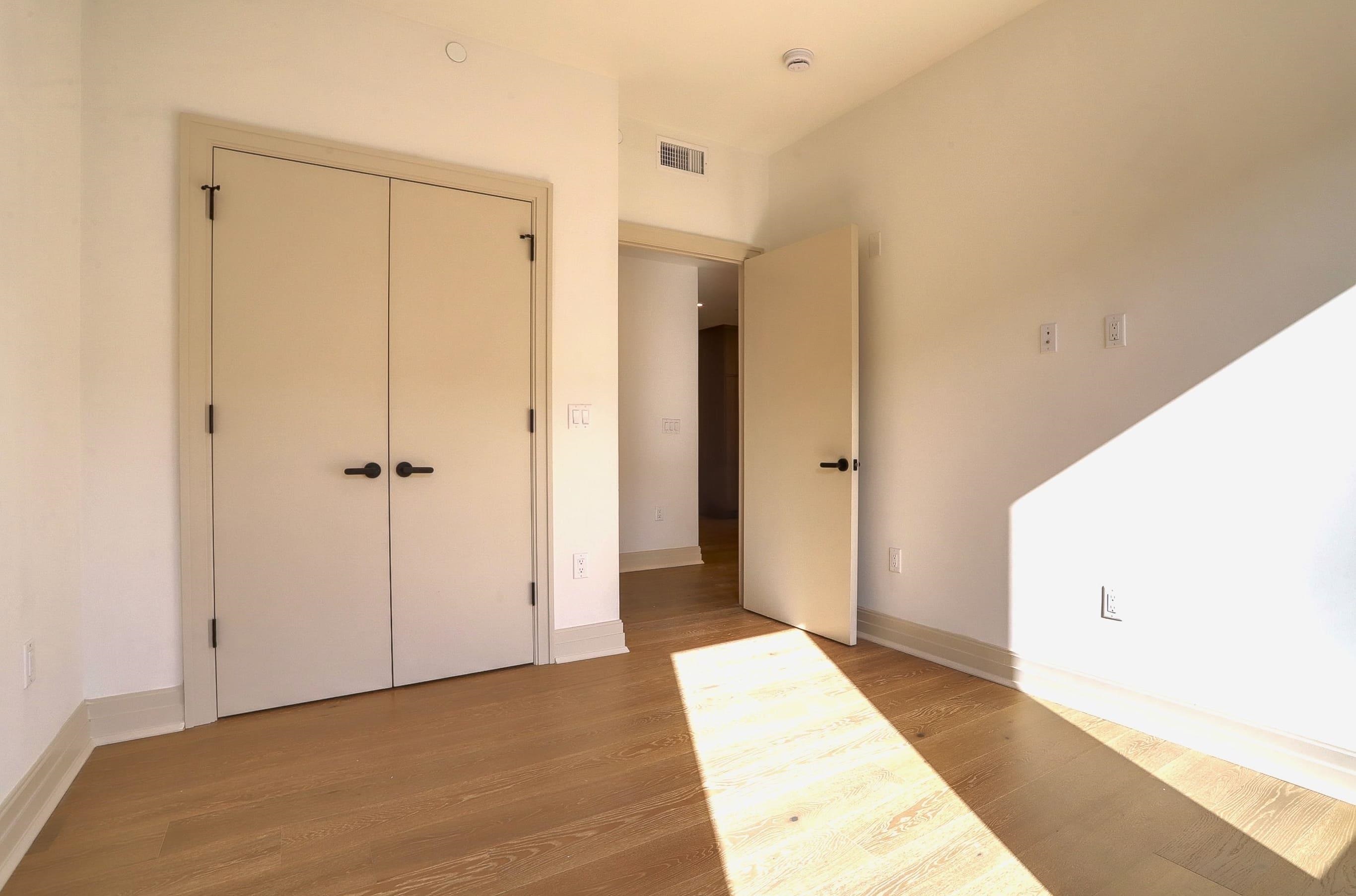 921 Madison Street, Unit 401 Hoboken, NJ 07030 - Photo 13 of 32 a view of a big room with closet and wooden floor