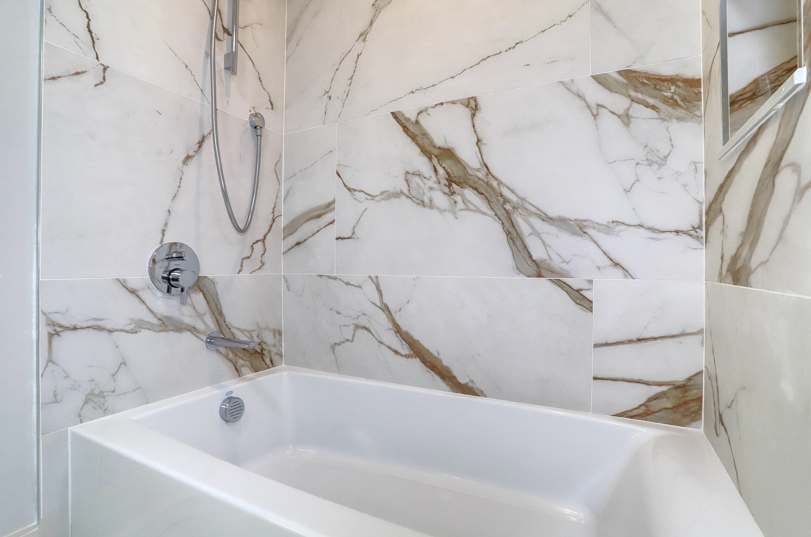 921 Madison Street, Unit 401 Hoboken, NJ 07030 - Photo 17 of 32 a bathroom with a bathtub
