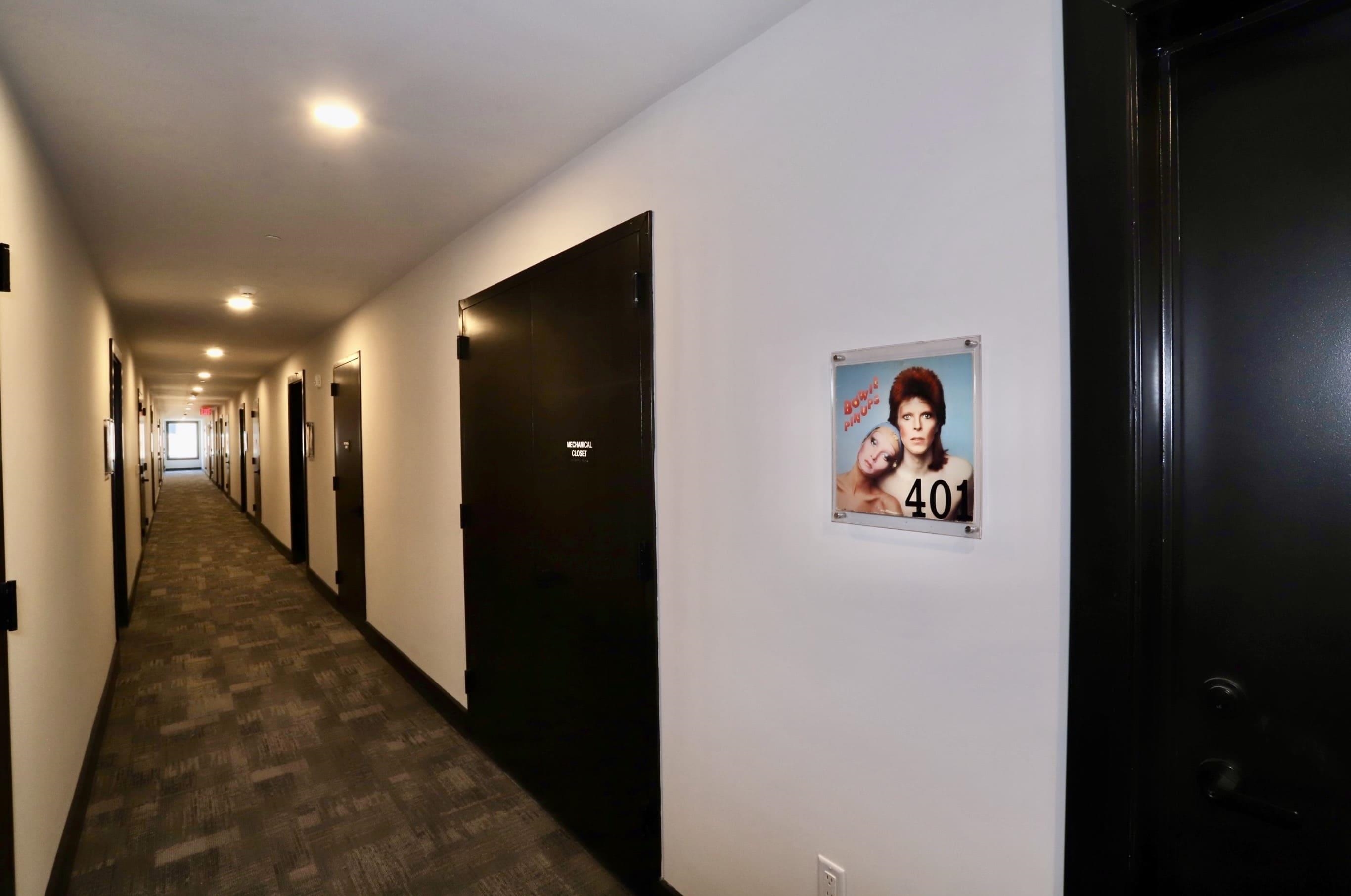 921 Madison Street, Unit 401 Hoboken, NJ 07030 - Photo 20 of 32 a view of a hallway with paintings on the wall